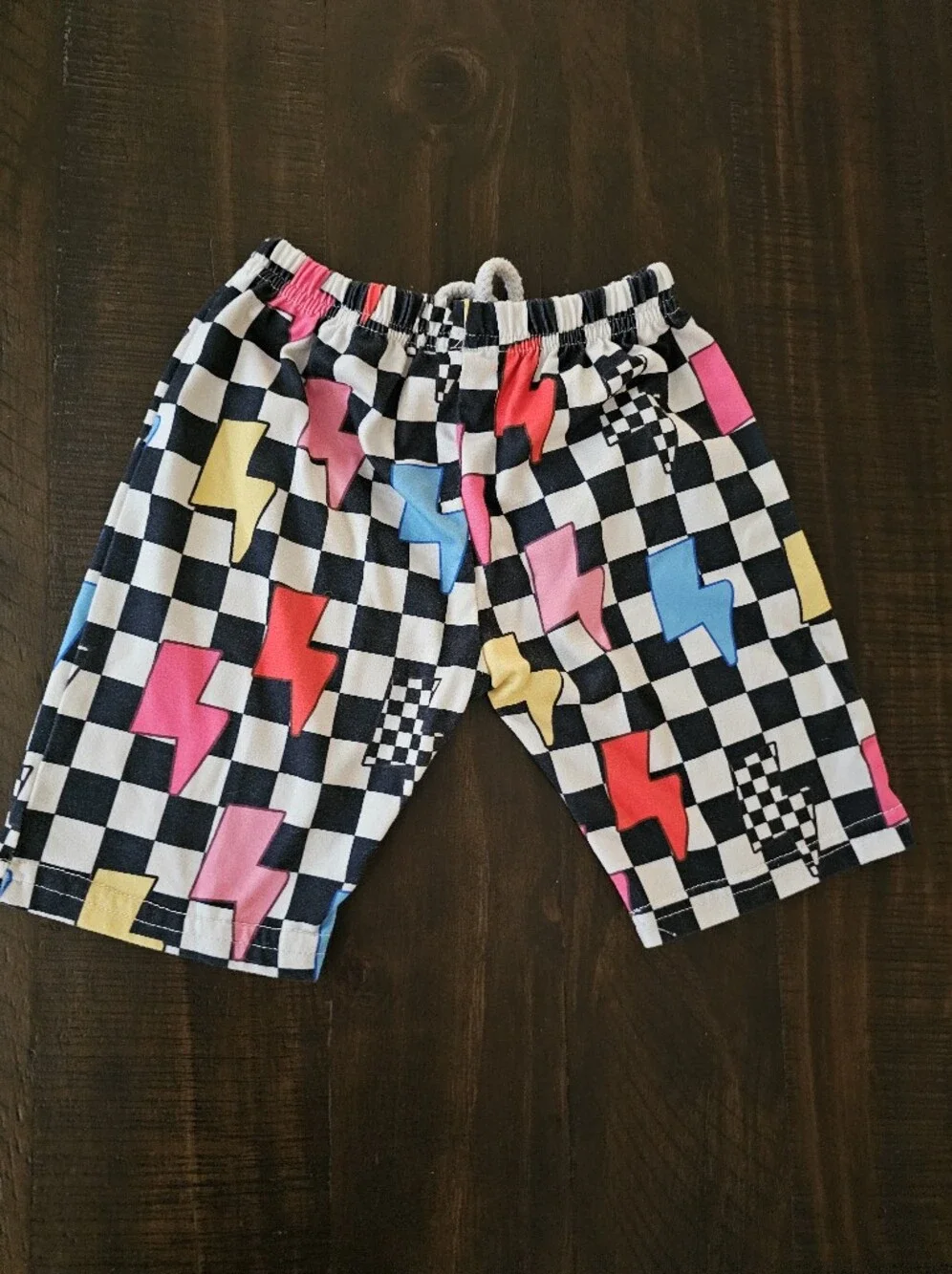 Kids Black Checkered Pajama Shorts with Pink, Blue & Yellow Lightning Bolts